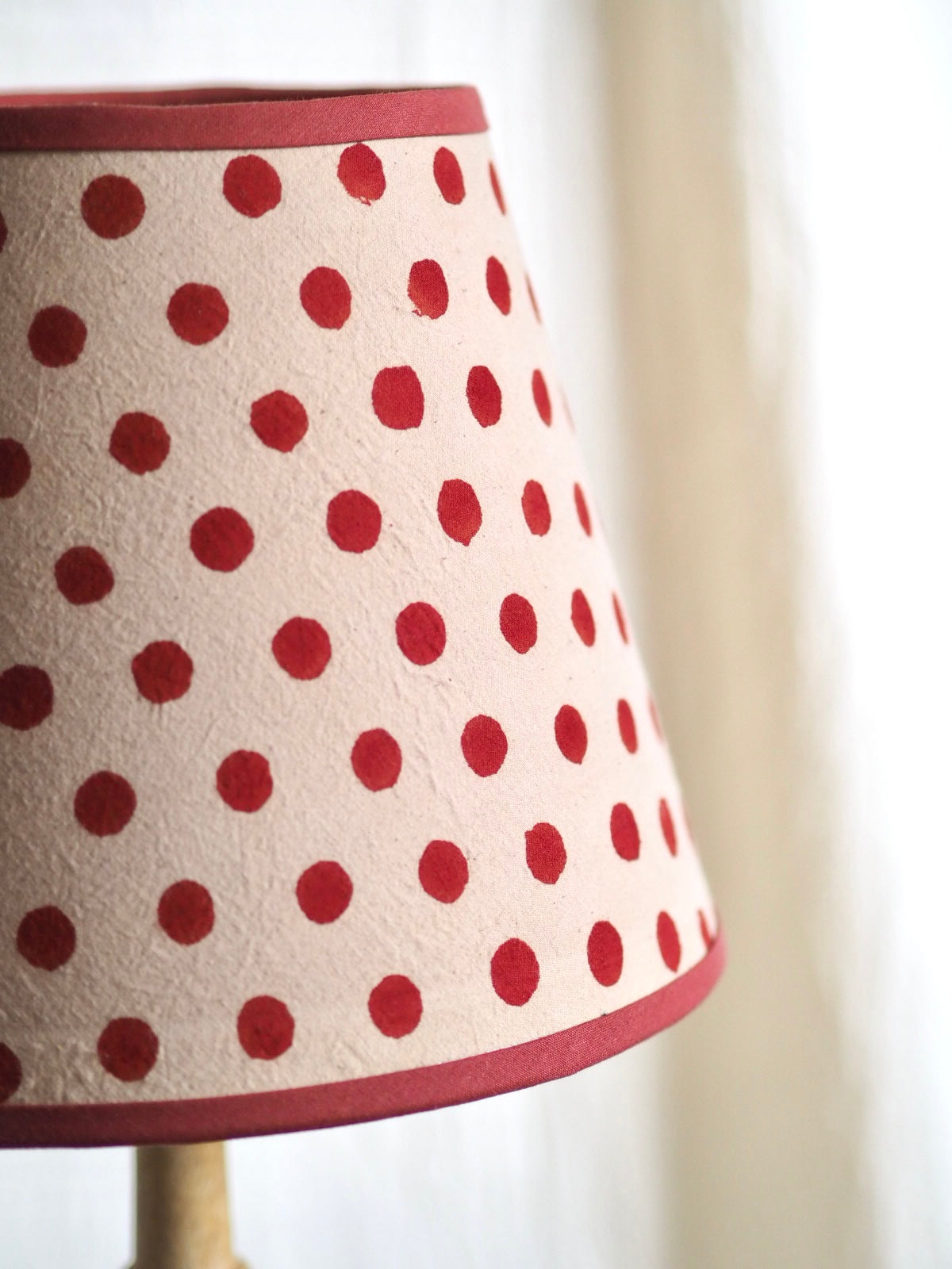 Handcrafted dotty rust lampshade with rust trim Charlotte Boyd